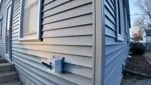 vinyl siding contractors on a modern home with fresh curb appeal