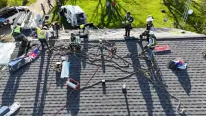 roofing crew installing asphalt shingles